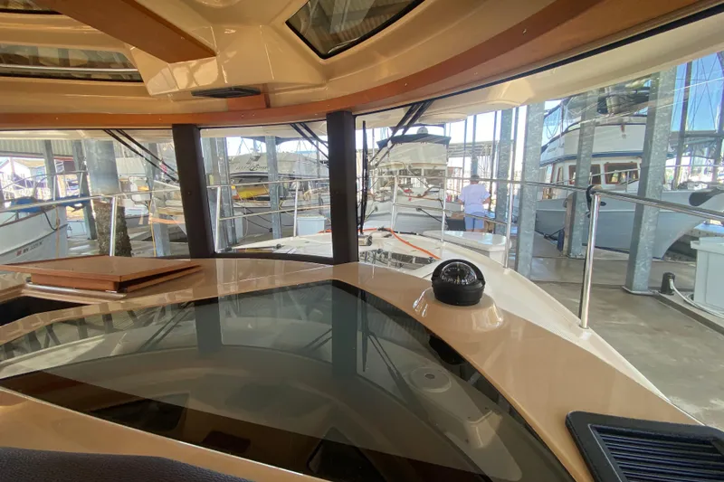 Slide: The Image of Interior view of 2019 Ranger Tugs R-29 S yacht in a marina setting. - 60