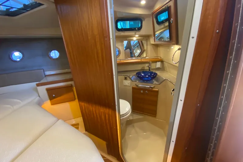 Slide: The Image of 2019 Ranger Tugs R-29 S interior with cozy cabin and modern bathroom. - 65