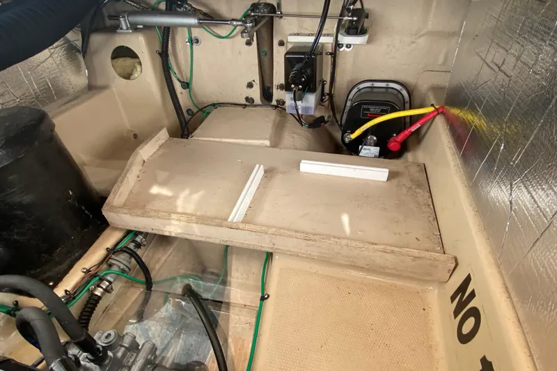 Slide: The Image of Engine compartment of 2019 Ranger Tugs R-29 S with visible wiring and components. - 77