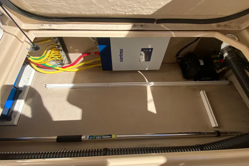 Slide: The Image of 2019 Ranger Tugs R-29 S electrical compartment with Xantrex inverter and wiring. - 78