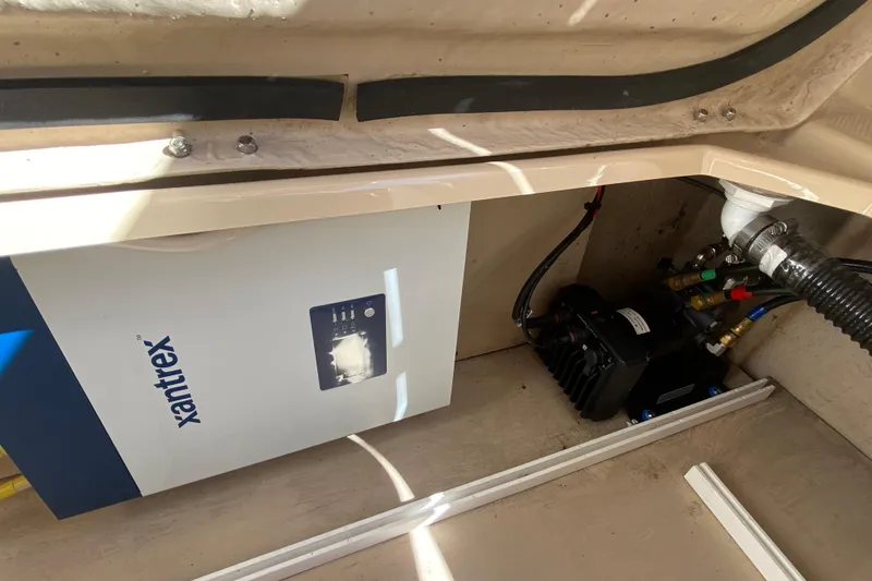 Slide: The Image of 2019 Ranger Tugs R-29 S engine compartment with Xantrex inverter and wiring. - 79