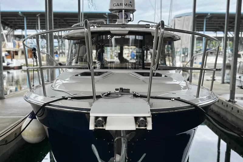 Slide: The Image of 2019 Ranger Tugs R-29 S boat docked in marina, front view. - 8
