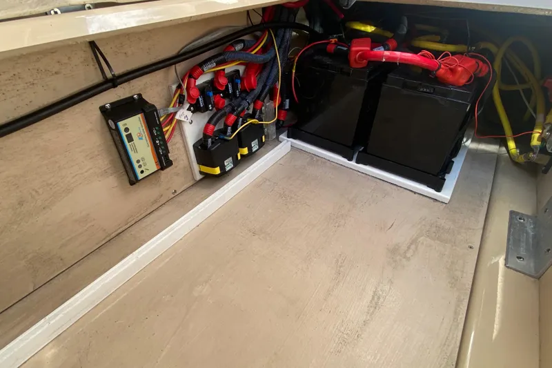 Slide: The Image of Electrical system of 2019 Ranger Tugs R-29 S with batteries and wiring. - 82