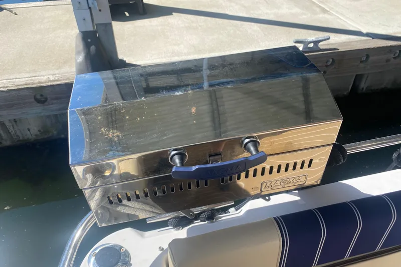 Slide: The Image of Stainless steel Magma grill on 2019 Ranger Tugs R-29 S boat docked by water. - 85
