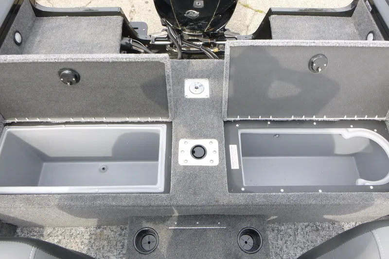 Slide: The Image of 2026 Tracker Targa V-18 WT boat storage compartments, open and empty, showcasing interior design. - 10