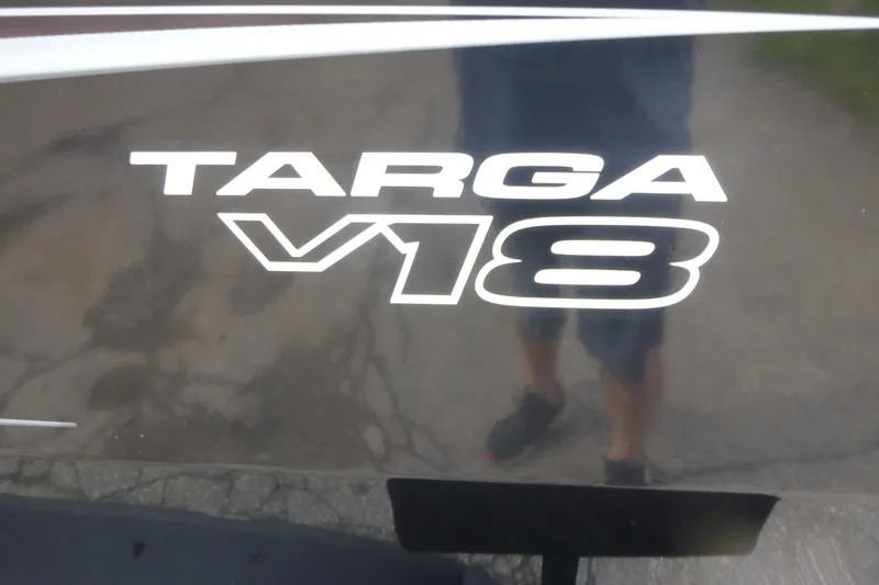 Slide: The Image of 2026 Tracker Targa V-18 WT logo on reflective surface. - 12