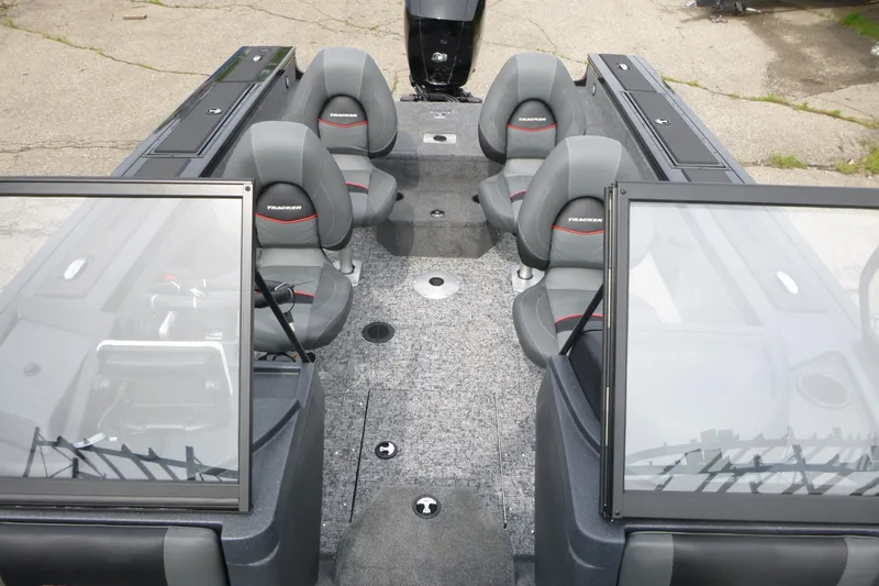 Slide: The Image of 2026 Tracker Targa V-18 WT boat interior with four gray seats and windshield. - 5