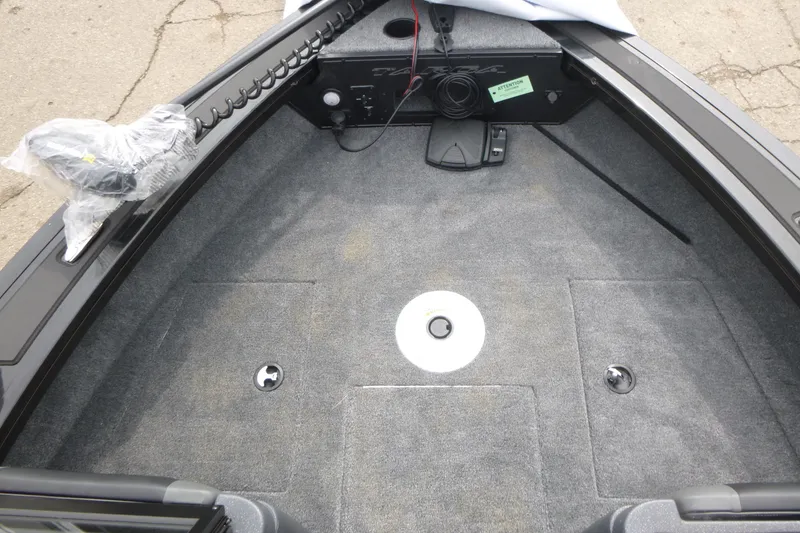 Slide: The Image of 2026 Tracker Targa V-18 WT boat interior with carpeted deck and storage compartments. - 6