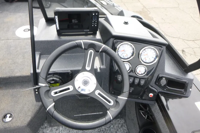 Slide: The Image of Steering console of 2026 Tracker Targa V-18 WT boat with gauges and navigation system. - 9