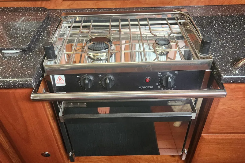 Slide: The Image of Stove and oven in 2011 Hunter 39 yacht kitchen with wooden cabinetry. - 17