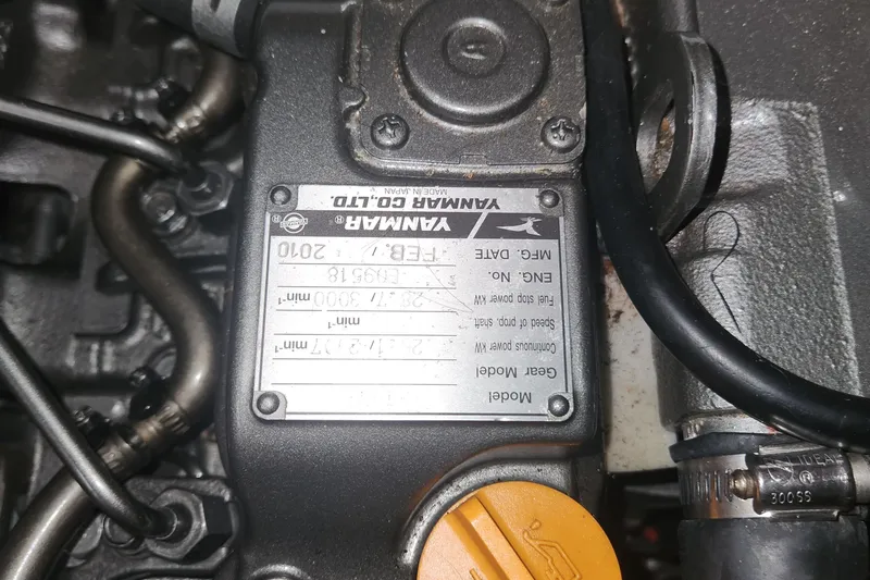 Slide: The Image of Close-up of a Yanmar engine label on a 2011 Hunter 39 sailboat. - 19