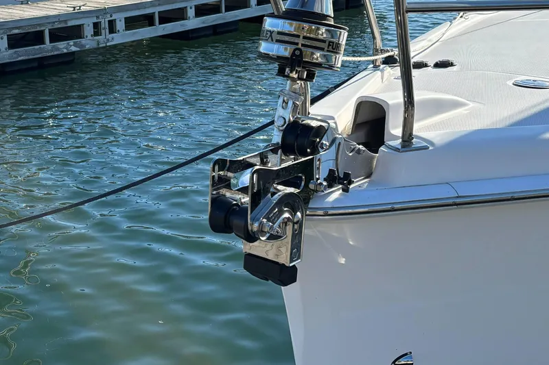 Slide: The Image of 2011 Hunter 39 sailboat bow with anchor mechanism at marina dock. - 2