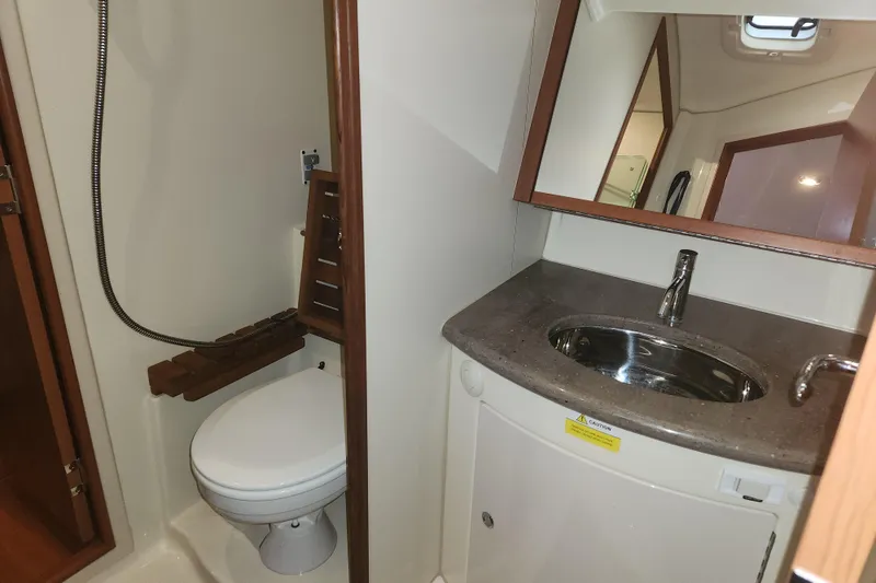 Slide: The Image of Bathroom in 2011 Hunter 39 yacht with sink, toilet, and showerhead. - 27