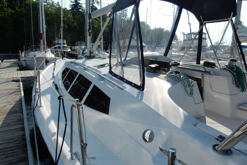 Slide: The Image of 2011 Hunter 39 sailboat docked at marina, featuring sleek design and modern amenities. - 30