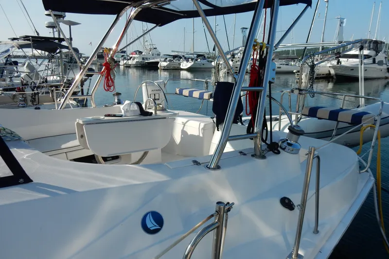 Slide: The Image of 2011 Hunter 39 sailboat docked in marina, featuring sleek design and modern amenities. - 31