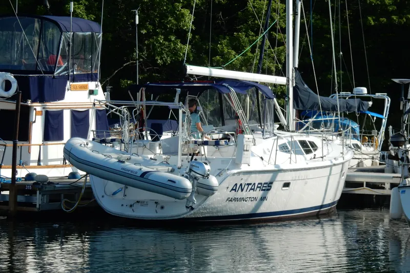 Slide: The Image of Sailboat "Antares" docked, Hunter 39 model, 2011, with inflatable dinghy attached. - 33