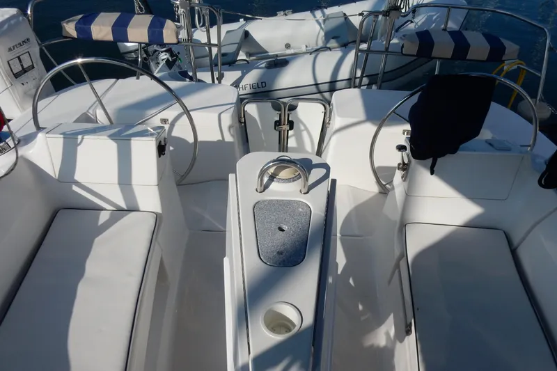 Slide: The Image of 2011 Hunter 39 sailboat cockpit with dual steering wheels and seating. - 38
