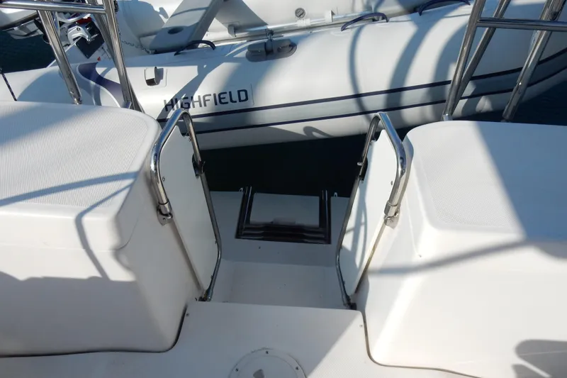 Slide: The Image of Hunter 39 yacht, 2011 model, featuring a swim platform and Highfield inflatable boat. - 39