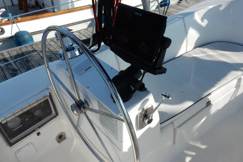 Slide: The Image of Steering wheel and navigation system on a 2011 Hunter 39 sailboat. - 41