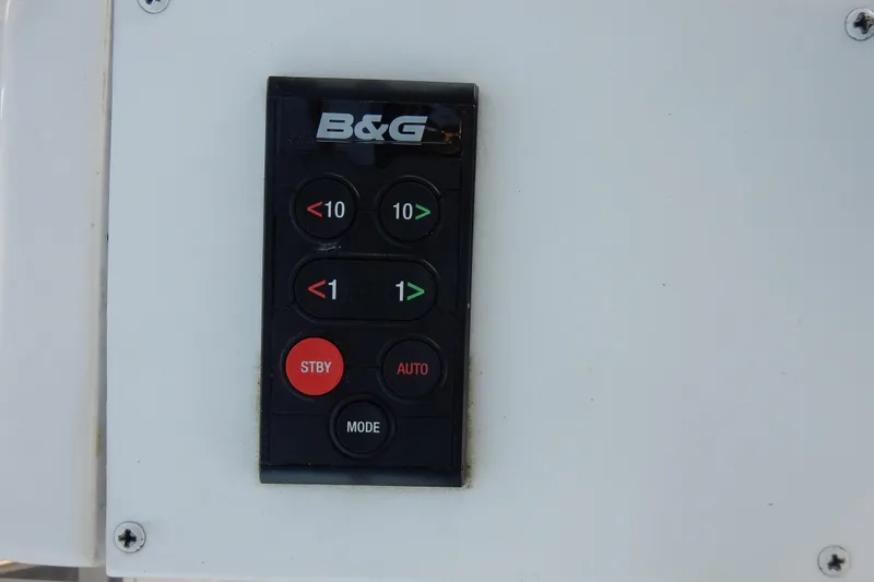 Slide: The Image of B&G control panel on 2011 Hunter 39 yacht, featuring navigation buttons. - 43