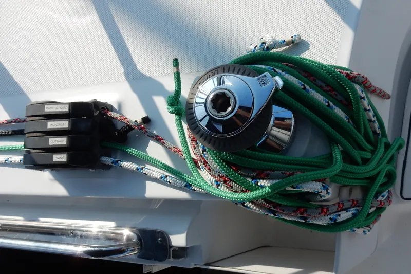 Slide: The Image of Sailing equipment on a 2011 Hunter 39 yacht, featuring ropes and winch. - 48