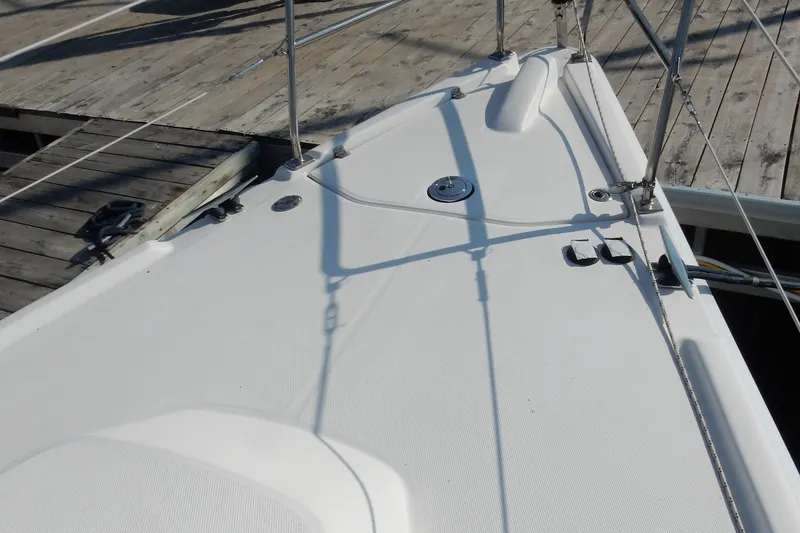 Slide: The Image of Deck of 2011 Hunter 39 sailboat docked at a wooden pier. - 53