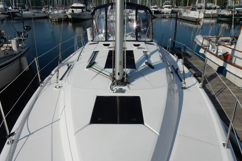 Slide: The Image of Sailboat deck view of 2011 Hunter 39 in marina setting. - 56