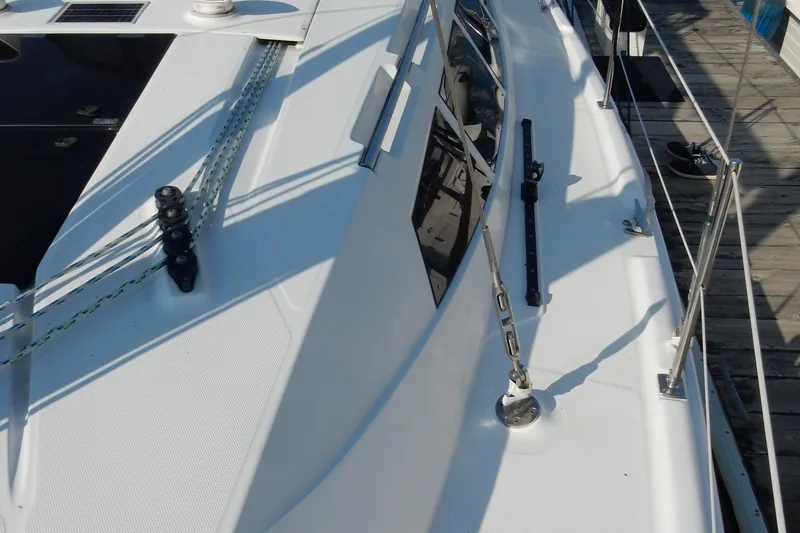 Slide: The Image of 2011 Hunter 39 sailboat deck with rigging and railing details. - 58