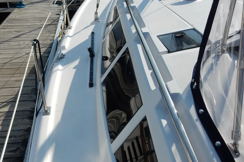 Slide: The Image of 2011 Hunter 39 sailboat deck with sleek design and modern fittings. - 59