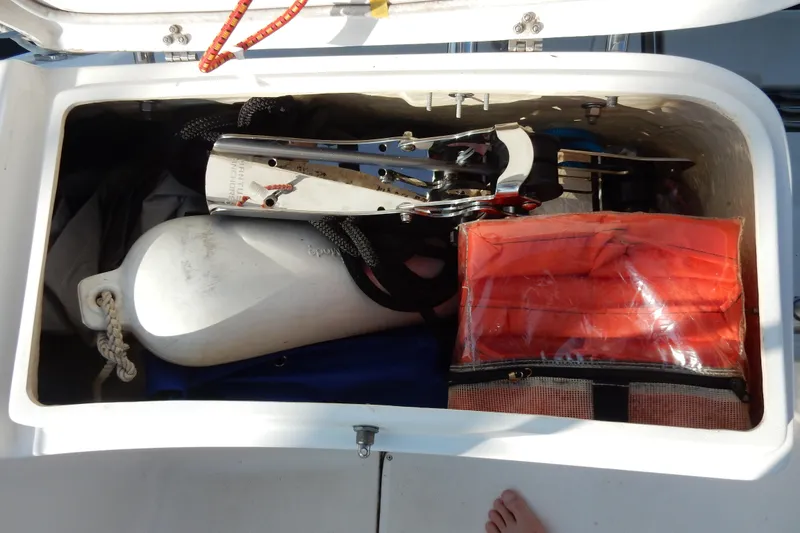 Slide: The Image of Storage compartment on a 2011 Hunter 39 sailboat with boating equipment and accessories. - 61