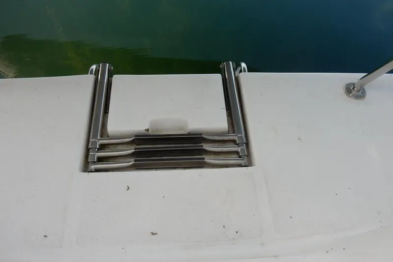 Slide: The Image of Stainless steel swim ladder on 2011 Hunter 39 boat, folded on deck. - 64