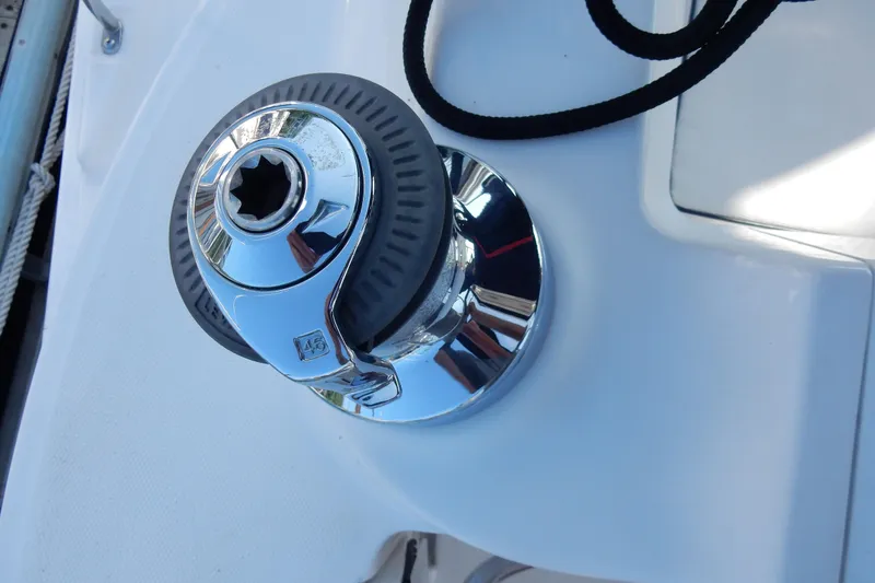 Slide: The Image of Chrome winch on 2011 Hunter 39 sailboat deck, featuring a black rope. - 65