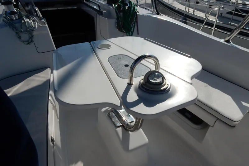 Slide: The Image of Cockpit of 2011 Hunter 39 sailboat with steering wheel and seating area. - 66