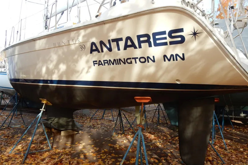 Slide: The Image of Sailboat "Antares" Hunter 39, 2011 model, on stands with autumn leaves. - 72