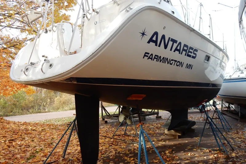 Slide: The Image of 2011 Hunter 39 sailboat "Antares" on stands, surrounded by autumn leaves. - 73