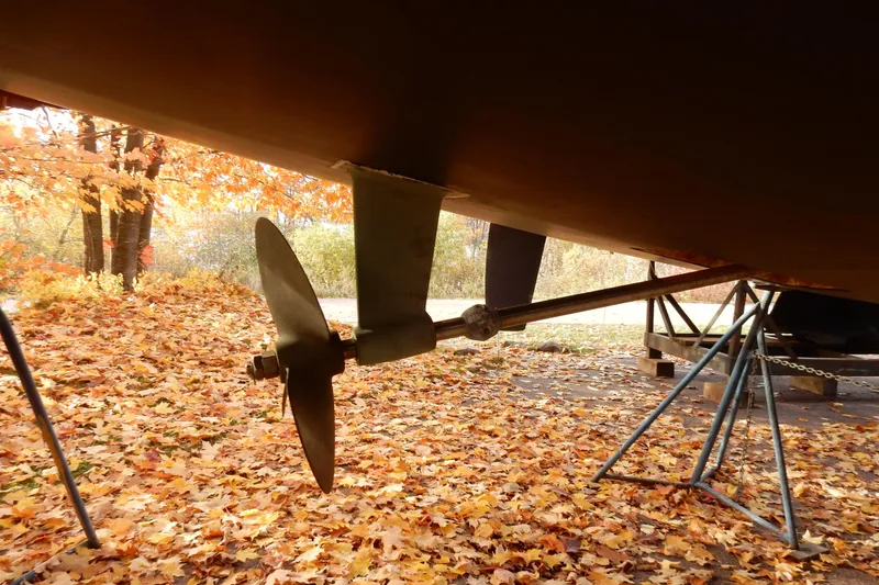 Slide: The Image of Propeller of 2011 Hunter 39 sailboat on autumn leaves background. - 75