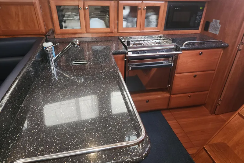 Slide: The Image of Luxurious 2011 Hunter 39 yacht kitchen with granite countertops and modern appliances. - 9