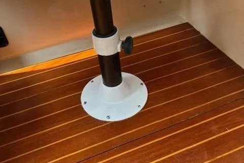 Slide: The Image of Teak flooring and pedestal base inside a 1984 Catalina 38 sailboat. - 17