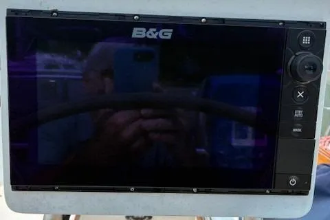 Slide: The Image of B&G marine display on a 1984 Catalina 38 sailboat, reflecting surroundings. - 20