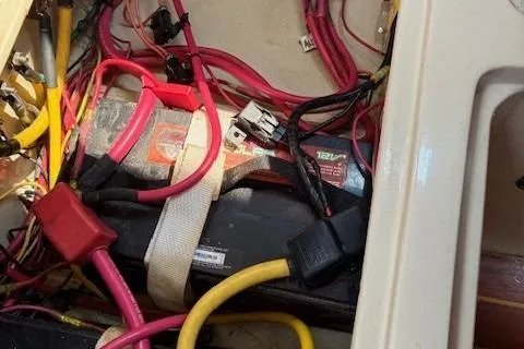 Slide: The Image of Battery compartment of 1984 Catalina 38 sailboat with wiring and connectors. - 24