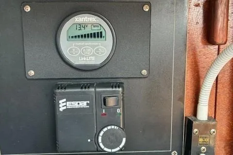 Slide: The Image of Control panel on a 1984 Catalina 38 sailboat featuring Xantrex and Espar systems. - 26