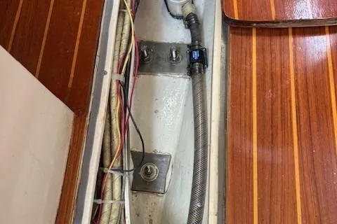 Slide: The Image of Interior view of a 1984 Catalina 38 sailboat showing wiring and plumbing details. - 3