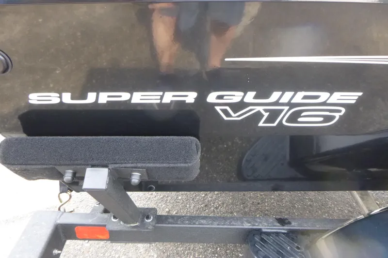 Slide: The Image of 2026 Tracker Super Guide V-16 SC boat logo on black surface. - 12