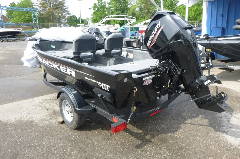 Slide: The Image of 2026 Tracker Super Guide V-16 SC boat with Mercury engine on trailer. - 3