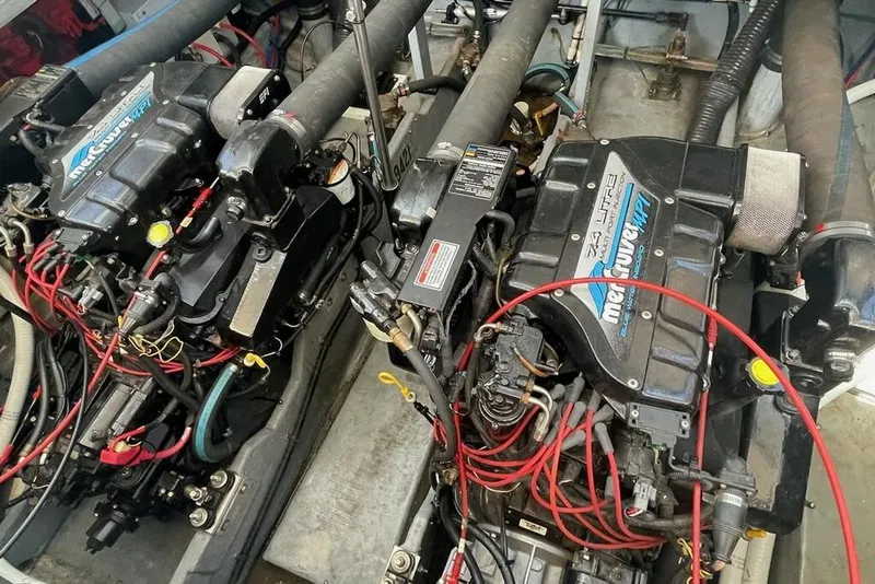 Slide: The Image of Twin MerCruiser engines in a 1997 Sea Ray 400 Sundancer boat engine room. - 7