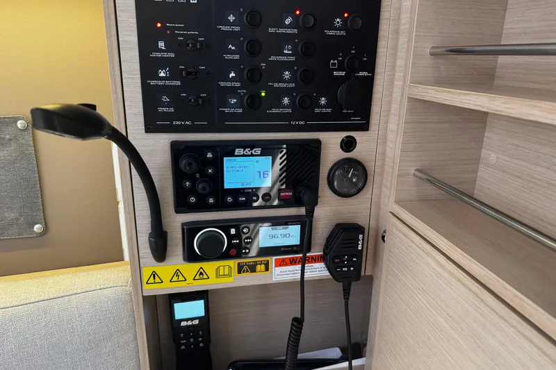 Slide: The Image of Control panel of a 2020 Beneteau Oceanis 30.1 sailboat with navigation equipment. - 17