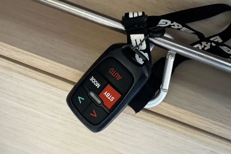 Slide: The Image of Remote control hanging on a Beneteau Oceanis 30.1 yacht, 2020 model. - 18