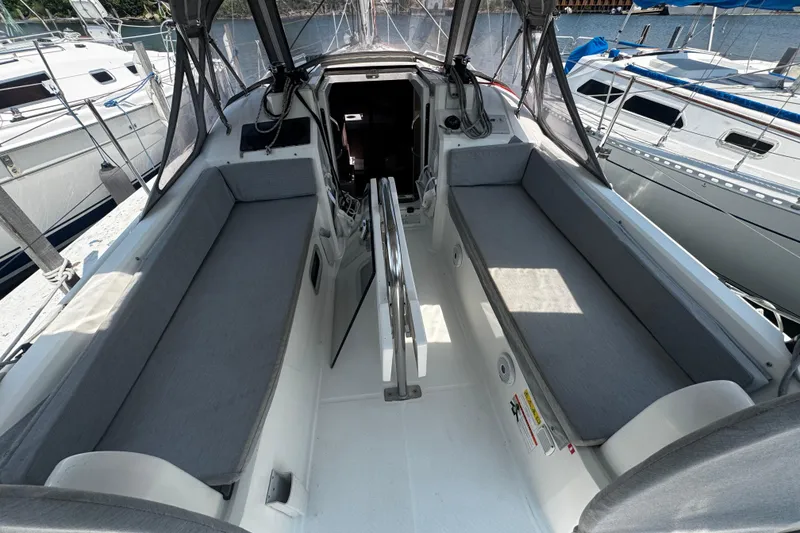 Slide: The Image of Cockpit of 2020 Beneteau Oceanis 30.1 sailboat with gray seating and canopy. - 6
