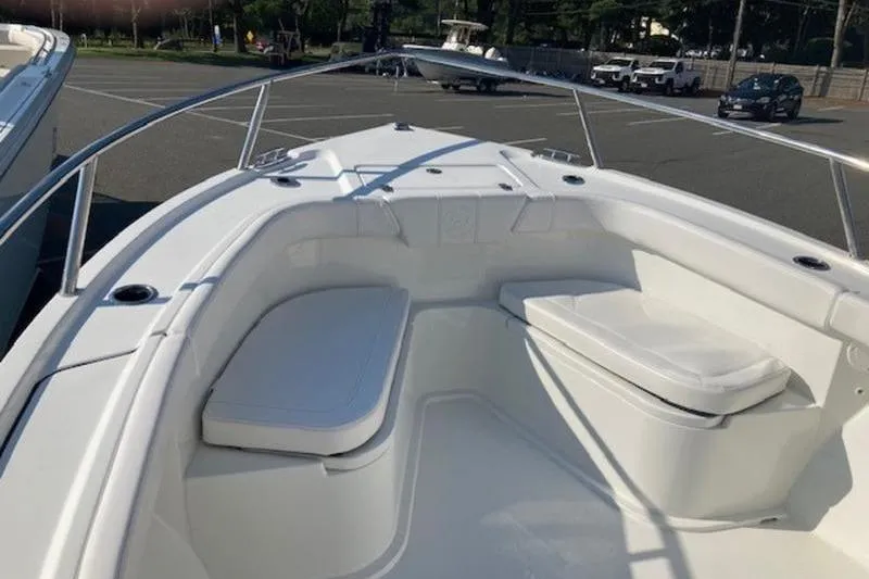 Slide: The Image of 2025 Parker 23 SE CC boat interior with cushioned seating and sleek design. - 3