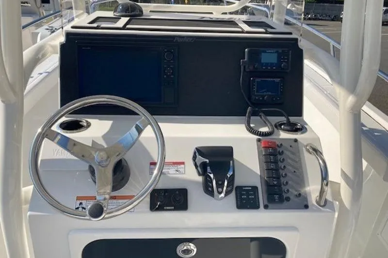 Slide: The Image of 2025 Parker 23 SE CC boat console with steering wheel and navigation controls. - 5